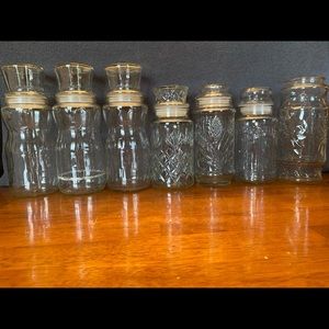 Seven vintage Planters Peanuts glass jars